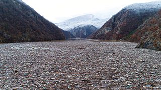 Waste floating in the Drina river near Visegrad, Bosnia, Friday, Jan. 20, 2023