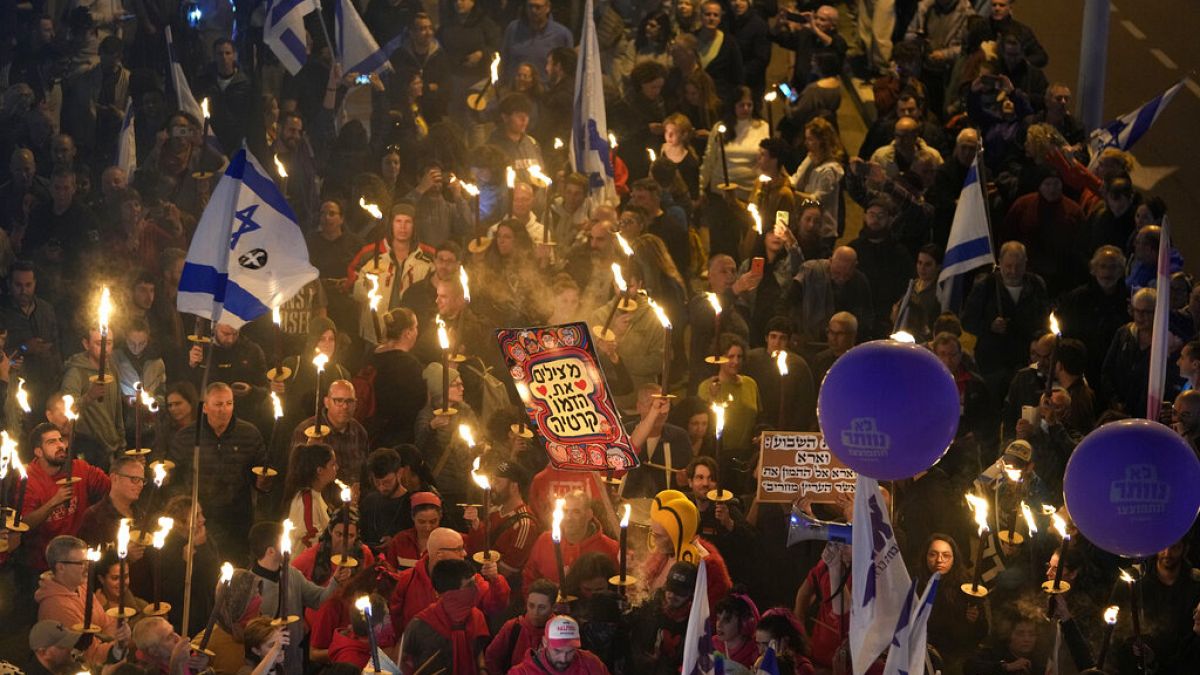 Tens of thousands of protesters gather in Tel Aviv