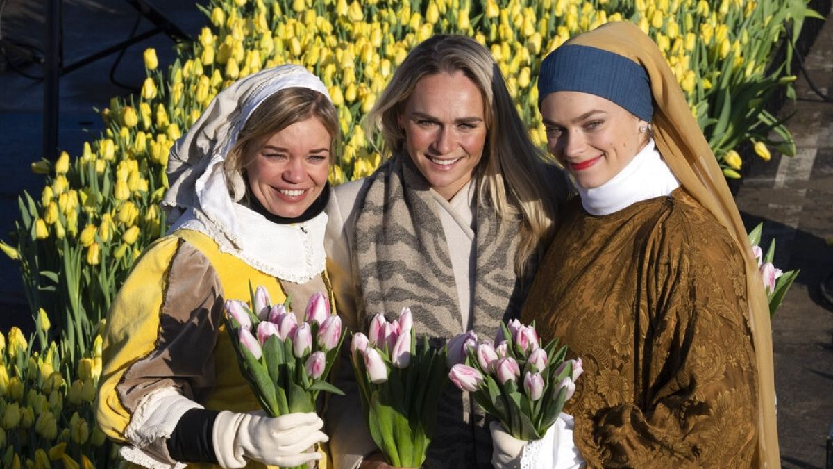 Three-time Olympic gold medallist Irene Schouten, centre, posed with women dressed in costumes inspired by Dutch Golden Age painter Johannes Vermeer's paintings