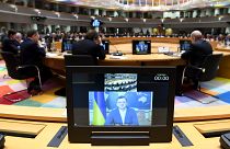 Dmytro Kuleba, Ukrainian Minister of Foreign Affairs appears on a screen at a high-level meeting in Brussels.