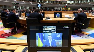 Dmytro Kuleba, Ukrainian Minister of Foreign Affairs appears on a screen at a high-level meeting in Brussels.