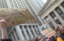 Protesters defending abortion rights chanted and held signs as they gathered in Wall Street, New York.