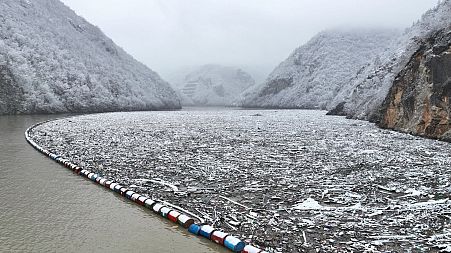 Tons of floating waste blocks the Drina river near Visegrad.