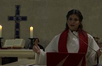 Sally Azar, a Palestinian pastor, speaks from the pulpit inside the Lutheran church in Jerusalem's Old City, January, 22, 2023