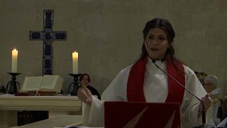 Sally Azar, a Palestinian pastor, speaks from the pulpit inside the Lutheran church in Jerusalem's Old City, January, 22, 2023