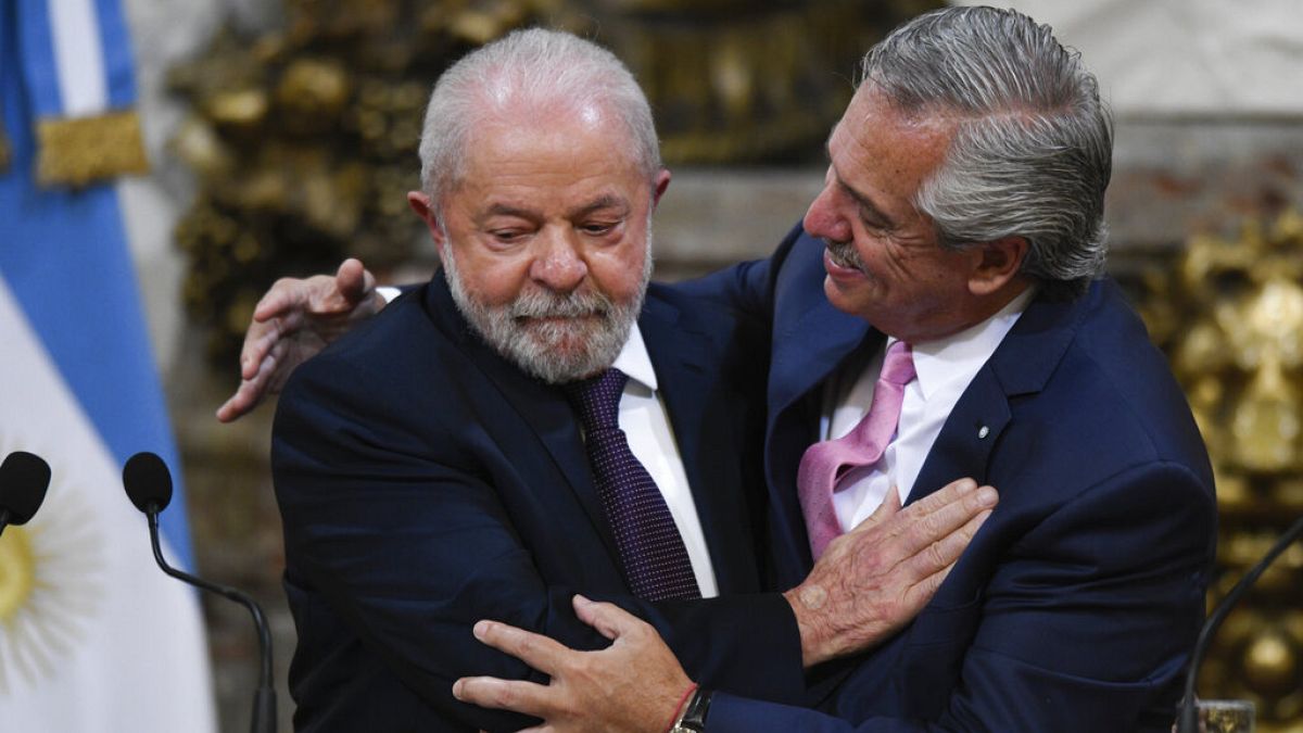 Brazilian President Luiz Inacio Lula da Silva, left, and Argentina's President Alberto Fernandez embrace at the government house in Buenos Aires, Argentina, Monday, Jan. 23