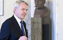 Finland's Foreign Minister Pekka Haavisto arrives for a news conference at the Parliament building in Helsinki, Finland, Tuesday, Jan. 24, 2023.