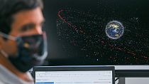 An engineer sits in front of a monitor showing an animation of space debris at the European Space Agency's new Space Safety Centre, in Darmstadt, Germany, Aprill 12, 2022.