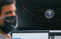 An engineer sits in front of a monitor showing an animation of space debris at the European Space Agency's new Space Safety Centre, in Darmstadt, Germany, Aprill 12, 2022.