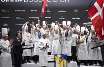 Danish chef Brian Mark Hansen, centre, celebrates with his teammates after winning the final of the "Bocuse d'Or" trophy in Lyon, France.