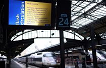 A photo shows a screen displaying a traffic alert message at a platform entrance during a total traffic shutdown at the Gare de l'Est train station in Paris on January 24, 202