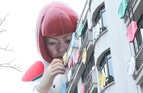 The installation of Japanese artist Yayoi Kusama, peering over the Louis Vuitton flagship store is pictured at the Champs-Élysées avenue in Paris, Sunday, Jan. 15, 2023.
