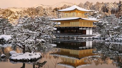 The grounds of Kinkakuji temple, the Golden Pavilion, are covered with snow in Kyoto, Japan