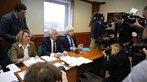 Members of the Moscow Helsinki Group and lawyers talk with journalists in the courtroom 