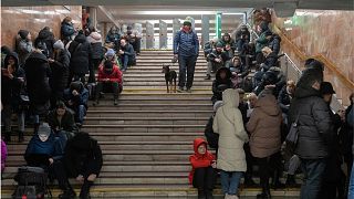 People gather in a subway station being used as a bomb shelter during a Russian rocket attack in Kyiv