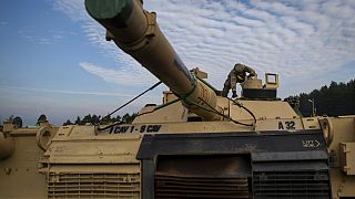  File photo of US Army's 1st Armored Battalion from Fort Hood in Texas prepare to unload Abrams battle tanks from rail cars as they arrive in Vilnius, Lithuania.