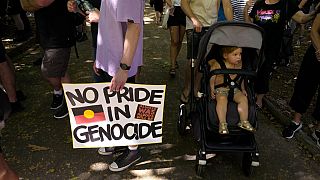 Un cartel reza: ningún orgullo en el genocidio, en una protesta en Sidney, Australia 26/1/2023 