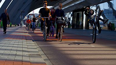 People cycling in Amsterdam, Netherlands in April 2020.