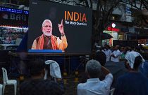 People watch the BBC documentary "India: The Modi Question", on an outdoor screen in Kochi on 24 January.