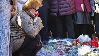 Mourners pay their respects following church attacks
