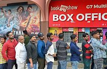 Fans lining up to watch "Pathaan" starring Shah Rukh Khan in Mumbai on 25 January.