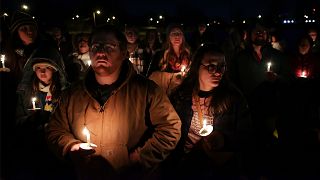 People attend a candlelight vigil for Tyre Nichols, who died after being beaten by Memphis police officers.