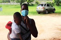 Primrose Saungweme holding her baby at Chikanga Polyclinic in Mutare.