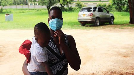 Primrose Saungweme holding her baby at Chikanga Polyclinic in Mutare.