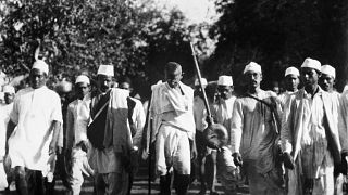 Mahatma Gandhi, with bared head and chest, leading his crusaders at the start of a march in the hope of changing salt laws during his civil disobedience campaign