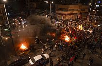 Palestinians celebrate after a shooting attack near a synagogue in Jerusalem, in Gaza City, Friday, Jan. 27, 2023. 