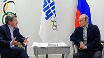 FILE - In this Feb. 15, 2014 photo Russian President Vladimir Putin, right, and IOC President Thomas Bach meet in the Bolshoi Ice Dome in Sochi, Russia.