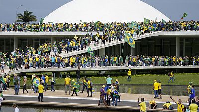 Protesters, supporters of Brazil's former President Jair Bolsonaro, storm the the National Congress building in Brasilia, 8 January 2023
