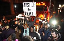 Protesters march down the street in Memphis on 27 January after authorities release footage of depicting five Memphis officers beating Tyre Nichols,