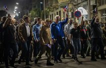 Cuba's President Miguel Diaz Canel, center right, and Raul Castro, center, take part in a march to mark the 167th anniversary of the birth of Cuba's national independence hero