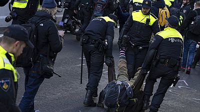 Police detained protestors after Extinction Rebellion activists and sympathisers blocked a busy road in The Hague.