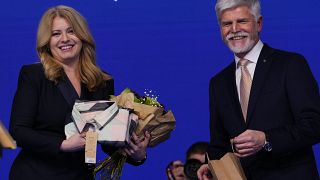 Czech Republic's President elect Petr Pavel and Slovakia's President Zuzana Caputova smile as they meet after announcement of the preliminary results of the presidential runof