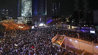 Israelis protest against the plans by Prime Minister Benjamin Netanyahu's new government to overhaul the judicial system, in Tel Aviv, Israel, Saturday, Jan. 28, 2023. 