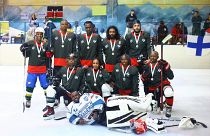 A group photo of The Kenya Ice Lions celebrating after taking part in a game