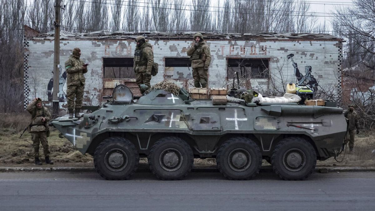 Ukrainian soldiers stand on an armored personnel carrier before going to the frontline in Donetsk region, Ukraine, Saturday, Jan. 28, 2023. 