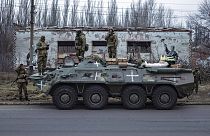 Ukrainian soldiers stand on an armored personnel carrier before going to the frontline in Donetsk region, Ukraine, Saturday, Jan. 28, 2023.
