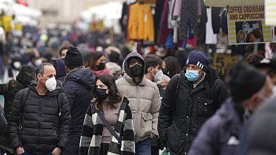 People wearing masks in Rome during the Covid pandemic: January 2022