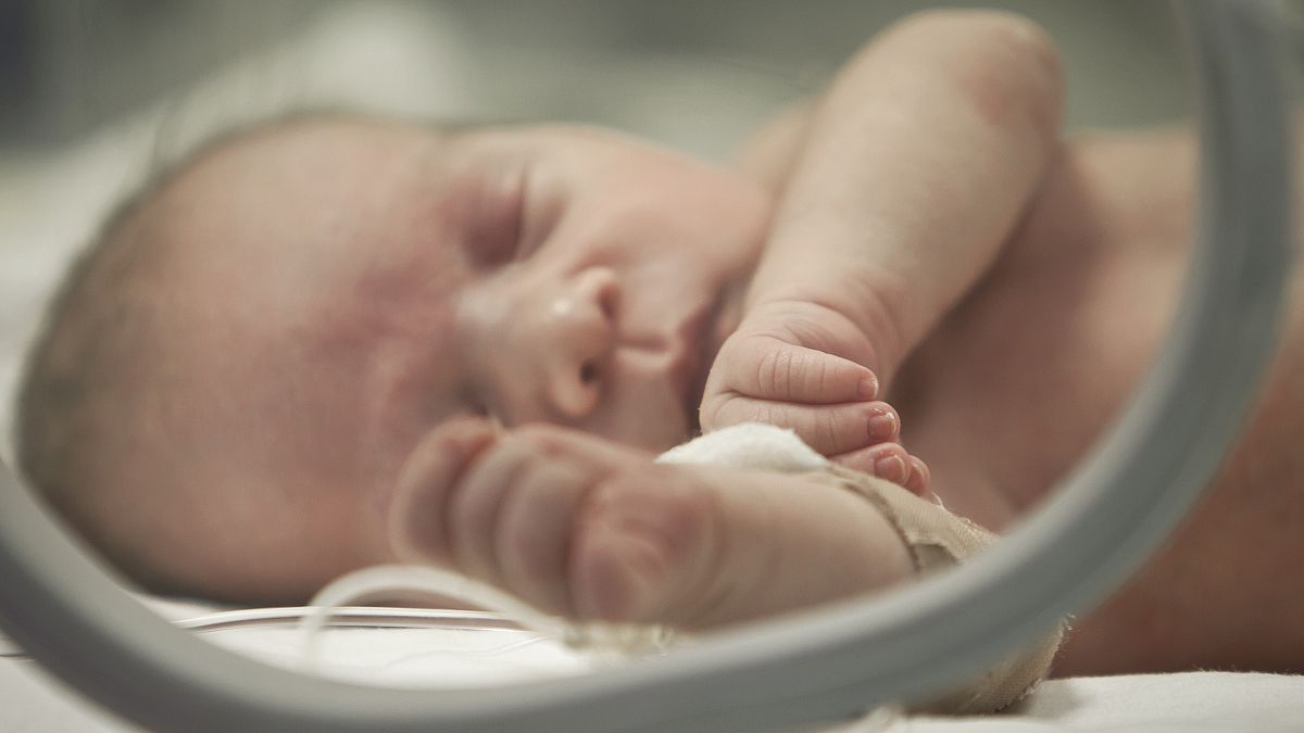 A newborn baby in the neonatal intensive care unit in Bucharest, Romania - 2012 archive