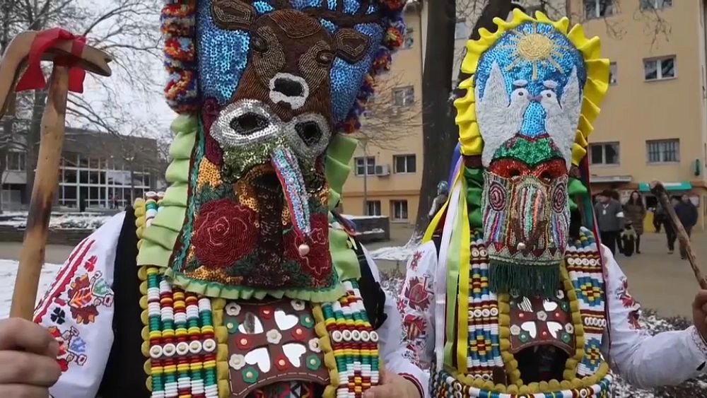 WATCH: Bulgarian folk performers dress in vibrant costumes for masked festival