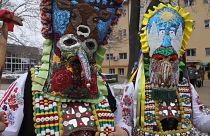 Masked men from south-eastern Bulgaria wear elaborate costumes, including masks and bells at the Surva festival