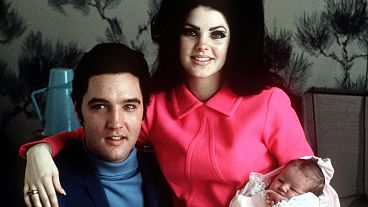 Elvis Presley poses with wife Priscilla and daughter Lisa Marie, in a room at Baptist hospital in Memphis, Tenn., February 05, 1968. 