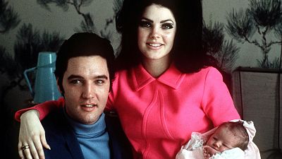 Elvis Presley poses with wife Priscilla and daughter Lisa Marie, in a room at Baptist hospital in Memphis, Tenn., February 05, 1968. 
