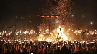 Members of the Jarl Squad in Lerwick, Scotland, on the Shetland Isles, perform the Up Helly Aa Viking festival, 28 January 2020 