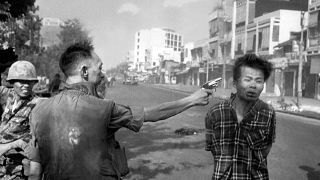 South Vietnamese General Nguyen Ngoc Loan, chief of the National Police, fires his pistol into the head of suspected Viet Cong officer Nguyen Van Lem