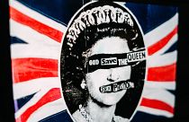 A promotional poster for the 1977 single God Save The Queen by the Sex Pistols on display.