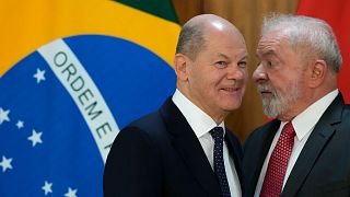 Brazil's President Luiz Inacio Lula da Silva, hight, and German Chancellor Olaf Scholz, after a press conference at Planalto Palace, in Brasilia, Brazil, Jan. 30, 2023.